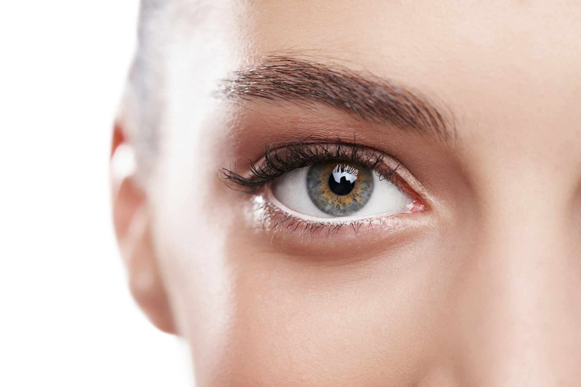 Beauty is in the EYE of the beholder. Closeup shot of a beautiful womans green eye.