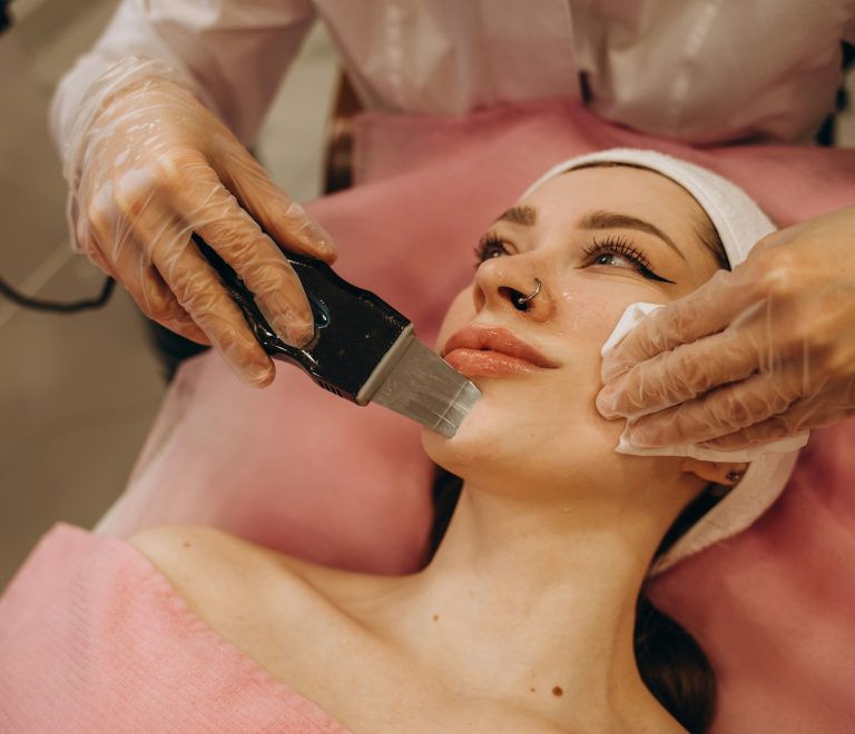 ultrasonic face cleaning, peeling, in a beauty salon