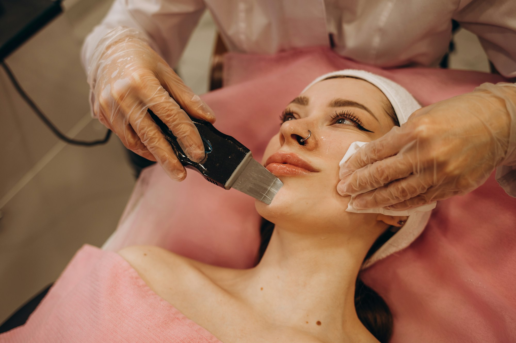 ultrasonic face cleaning, peeling, in a beauty salon