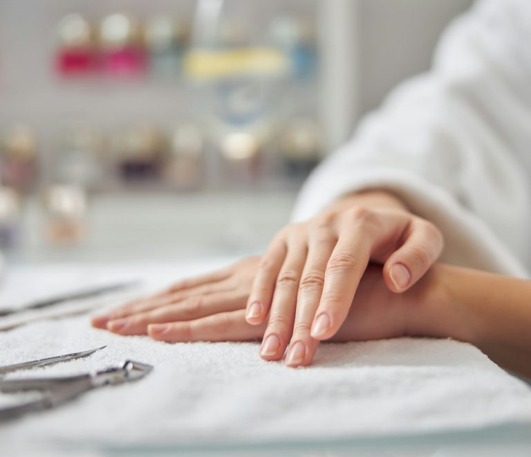 Woman coming to nail artist for manicure