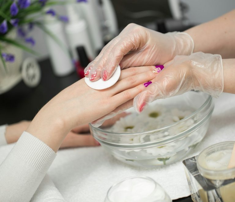 Woman is getting manicure in a beauty salon. Hands Spa. Manicure concept